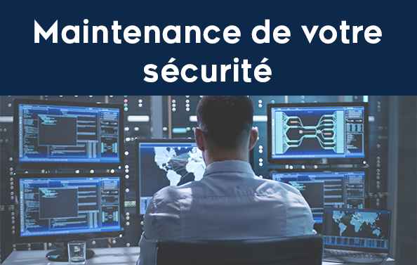 Personne de dos qui gère la sécurité informatique d'une entreprise avec plusieurs écrans de surveillance